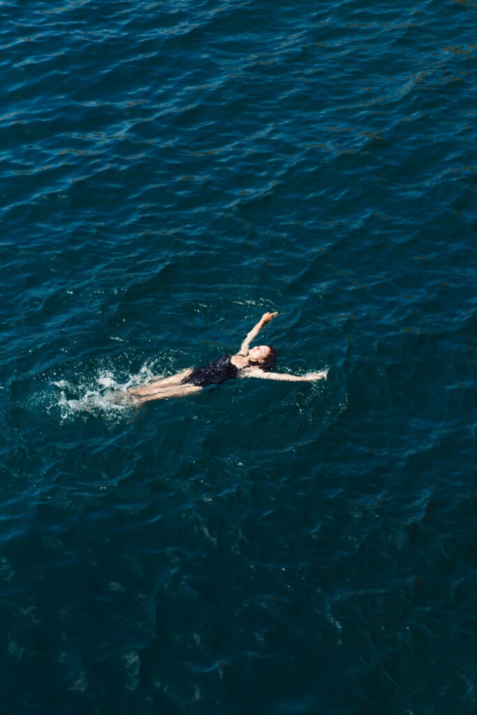 Woman floating in open water