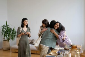 Group of friends embracing at a gathering, community and support